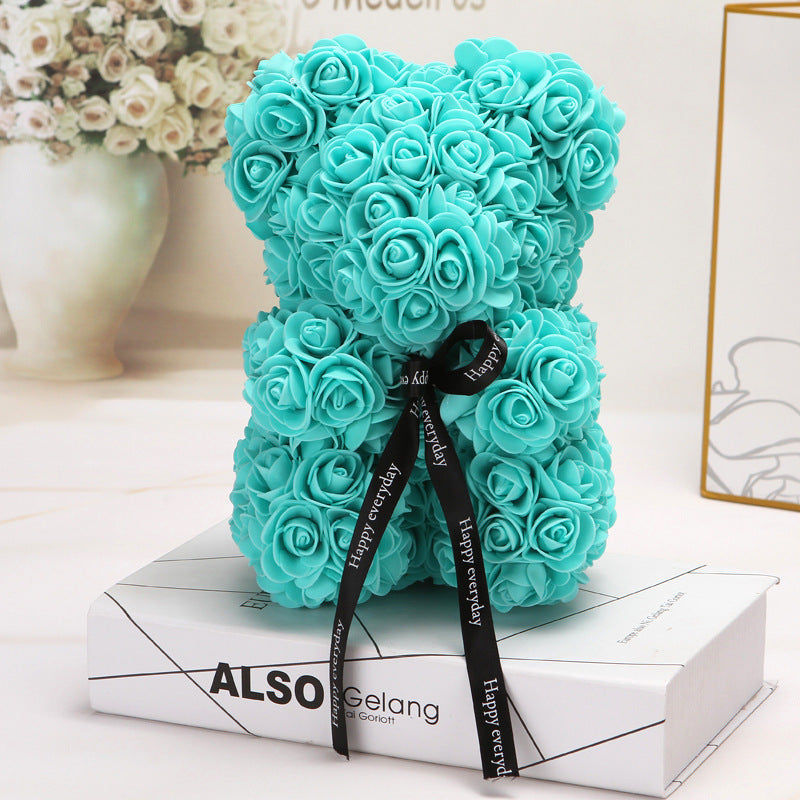 ours créatif fait de roses turquoises avec ruban noir décoratif